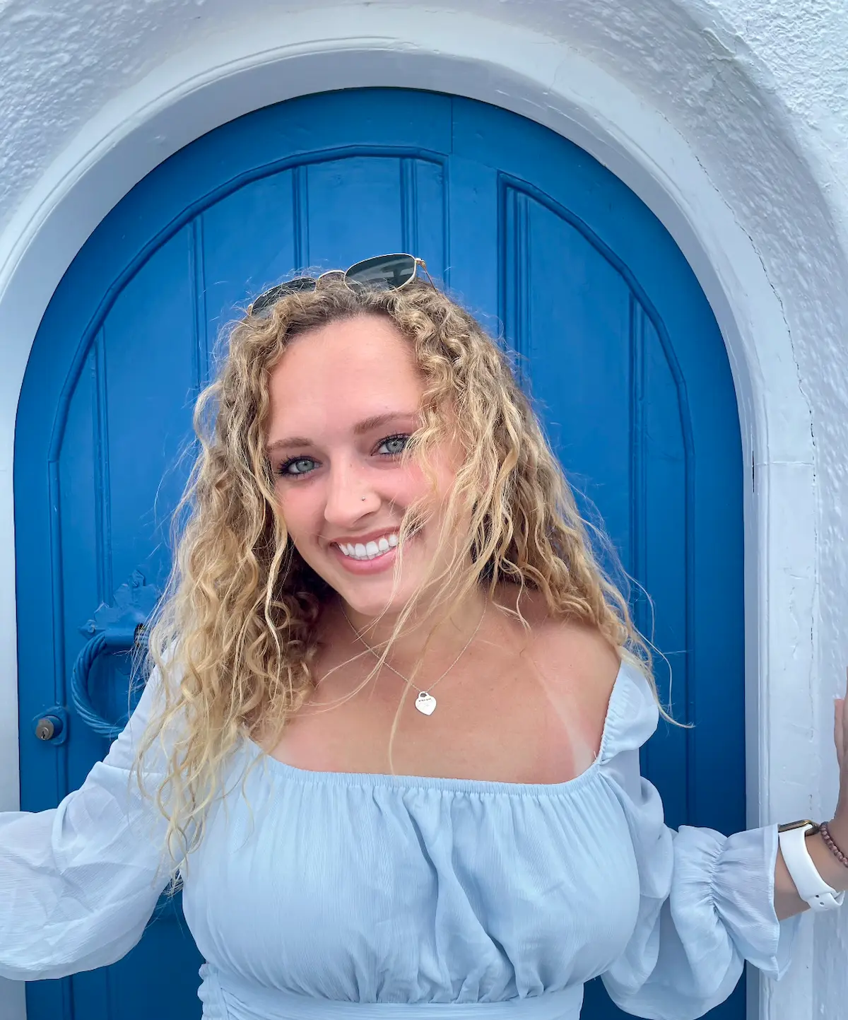 Grace enjoying a scenic cafe overlooking the sea